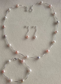Custom made freshwater pearl necklace, bracelet and earring set.